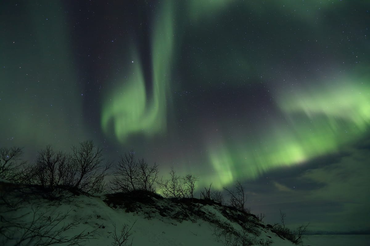 Northern lights over Lake Torneträsk in Abisko National Park