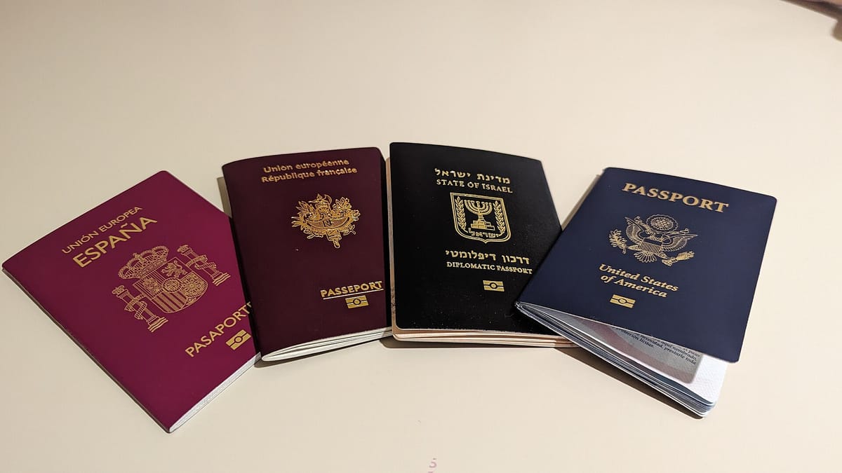 Four passports from different countries side by side