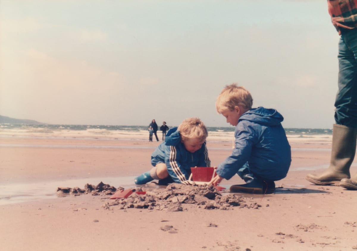 Children playing in the sand on a beach